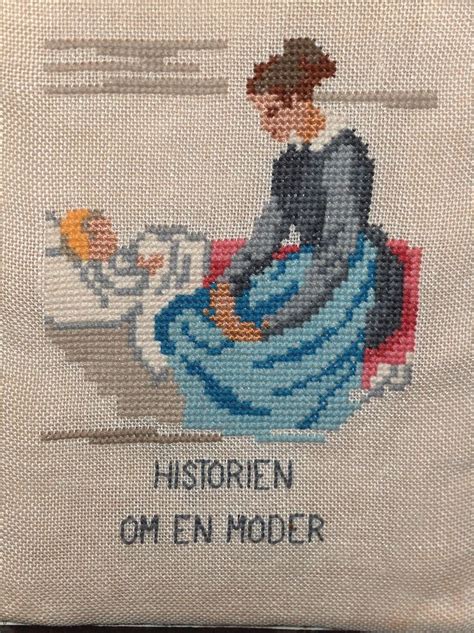 A Cross Stitched Picture Of A Woman Sitting At A Table