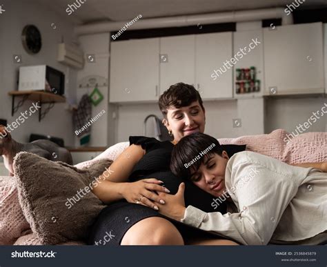 Expectant Lesbian Couple Embracing Belly While Stock Photo 2536845879