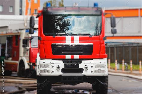 Fire Fighting Equipment In The City With Red Fire Engine Truck During