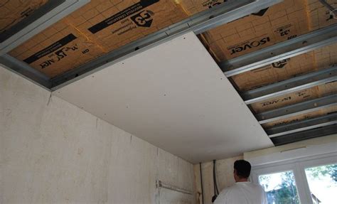 A Man Standing In A Room Under Construction