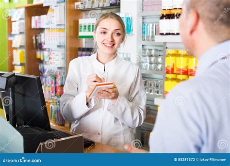 Pharmacist Serving Client In Pharmacy Stock Photo Image Of Medicine