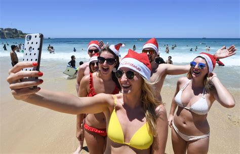 Bikini Babes In Santa Hats Join Thousands Of Christmas Day Revellers On Australia S Bondi Beach