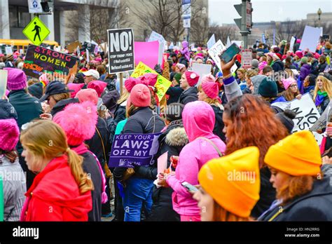 Large Crowd Of Protesters Many Wearing Pink Pussy Hats Holding Anti