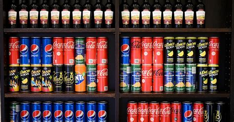 Cans of Soda Standing on the Shelves · Free Stock Photo