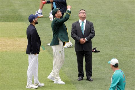 Tim Paine and Virat Kohli at the toss with match referee David Boon ...