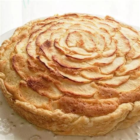 An Apple Pie Sitting On Top Of A White Plate