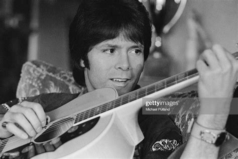 British Pop Singer Cliff Richard Playing An Acoustic Guitar 25th