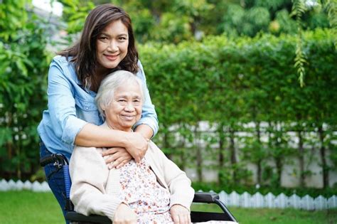 Premium Photo Caregiver Help Asian Elderly Woman Disability Patient