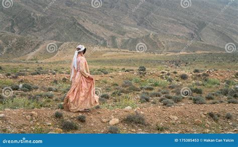 Beautiful Qashqai Nomadic Woman Walking In Meadow Shiraz Iran