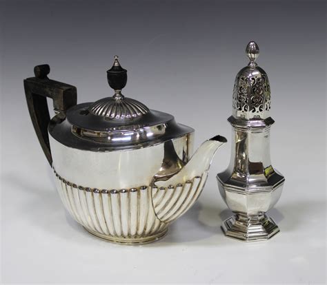 A Late Victorian Silver Teapot Of Half Reeded Form London 1895 By