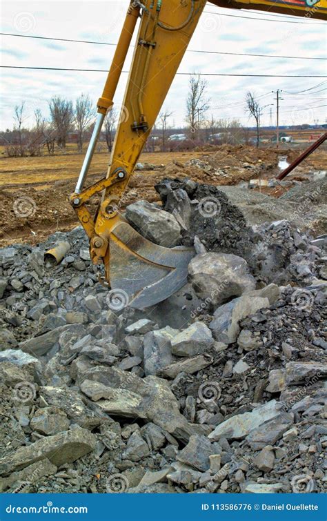 Excavator Bucket Digging Rocks Stock Photo - Image of aggregate ...