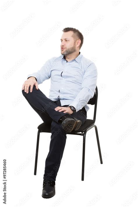 Man Sitting In Chair Legs Crossed