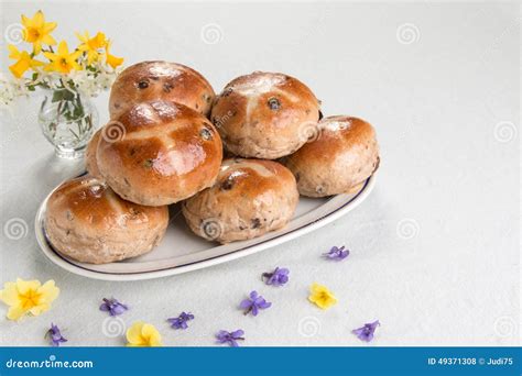 Hot Cross Buns On An Oval Plate With A Vase Of Flowers Stock Photo Image Of Baking Oval