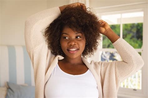 Premium Photo Portrait Of Smiling African American Woman Touching Her