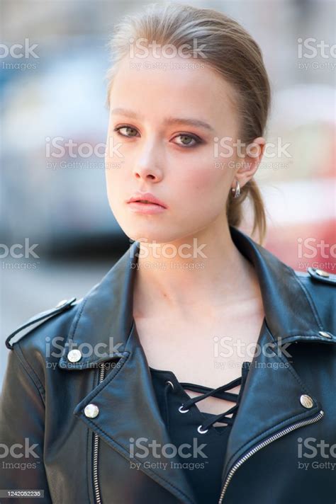 Beautiful Young Blonde Outdoors Portrait In A Leather Jacket Stock