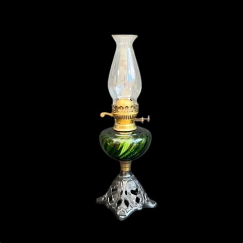 A Black Patinated Cast Brass Patterned Oil Lamp Base With Green Swirl