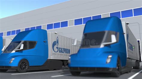 Semi Trailer Trucks With Gazprom Logo Being Loaded Or Unloaded At