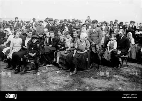 Immigrants seated in rows at Ellis Island, New York, USA. Ellis Island ...