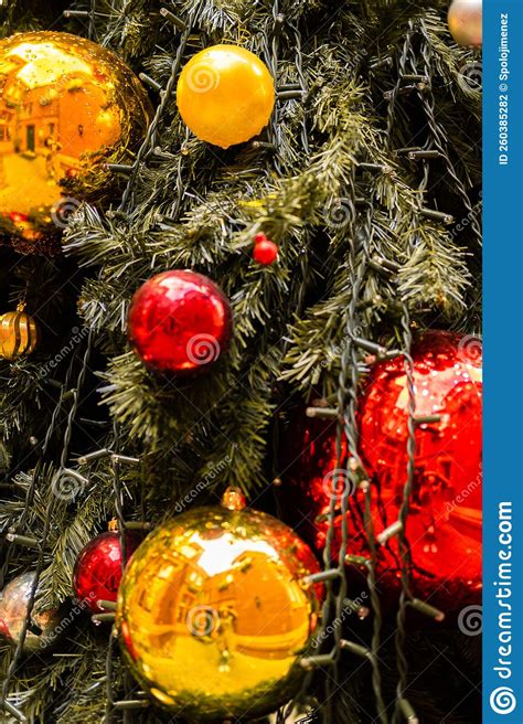 Close Up Of A Outdoor Decorated Christmas Tree With Wet Baubles Stock