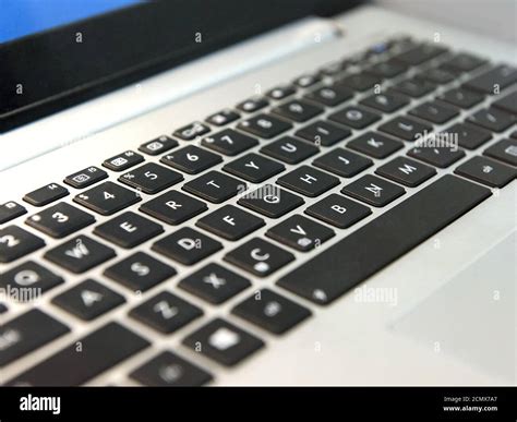 white laptop keyboard with black keys closeup Stock Photo - Alamy