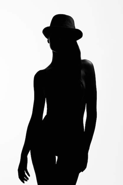 Premium Photo Female Silhouette Naked Girl In Hat Black And White Contour