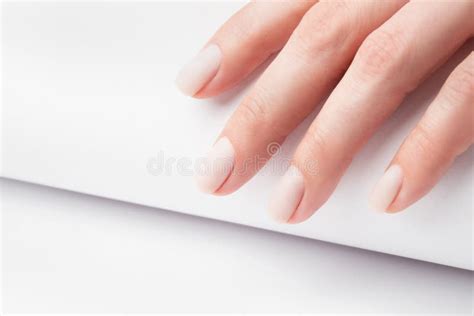 Matt Nude Nails Close Up On The Trendy Light Background Woman Manicure