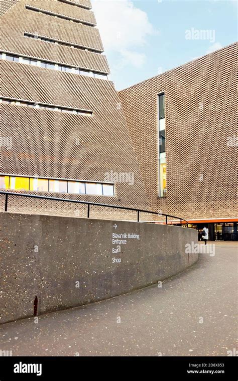 Exterior of Tate modern museum architecture with blue sky in London Stock Photo - Alamy