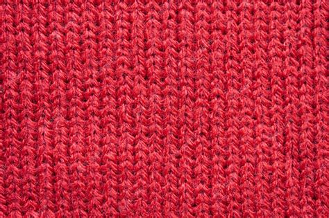 Premium Photo | Red knitted wool fabric texture background