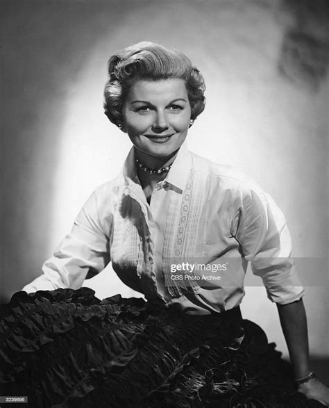 Studio portrait of American actor Barbara Billingsley seated and