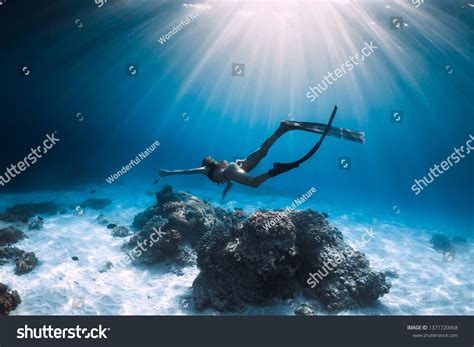 Woman Freediver Glides Fins Over Sandy Stock Photo