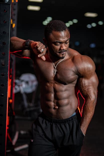 Premium Photo Fitness Male Model With Naked Torso Poses To The Camera