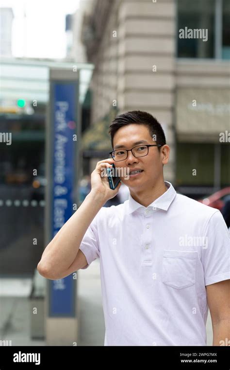 Chinese Businessman Talking On Cell Phone Stock Photo Alamy