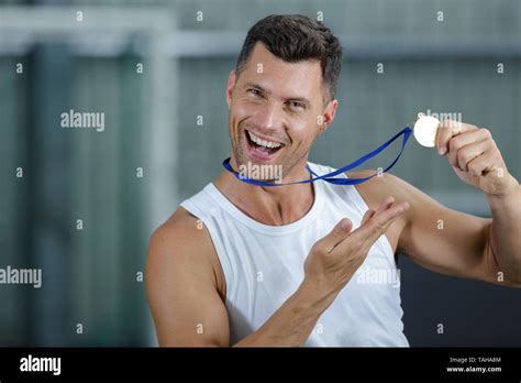 Athlete Holding Medal Stock Photo Alamy