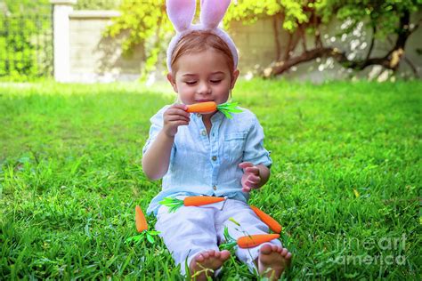 Easter baby bunny eating carrot Photograph by Anna Om | Fine Art America