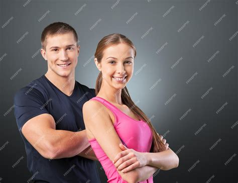 Premium Photo | Fitness instructors posing over white background