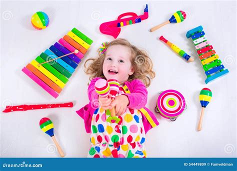 Adorable Little Girl With Music Instruments Stock Photo - Image: 54449809