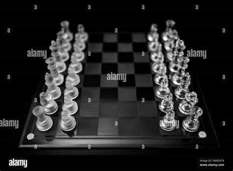 Glass chess board with pieces Stock Photo - Alamy