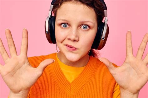 Premium Photo Cheerful Woman Listening To Music With Headphones