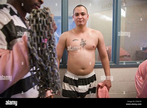 Inmates wait to be searched for contraband at Estrella Jail in Phoenix ...