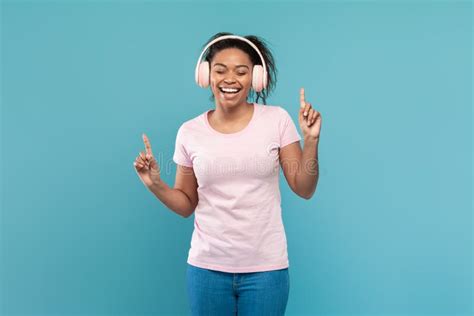 Happy African American Woman In Wireless Headphones Listening To