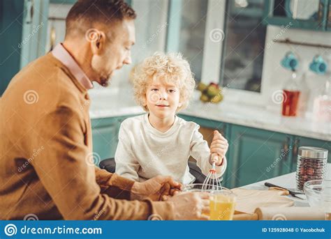 Curly Blonde Haired Boy Helping His Father In The Kitchen Stock Photo Image Of Meal Kitchen