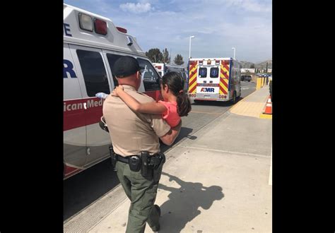 Moreno Valley Police Officer Calms a Frantic Mother by Carrying Her ...