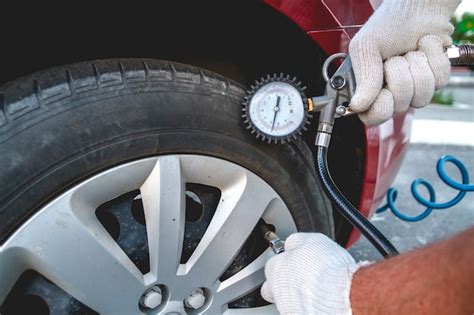 Premium Photo Pumping Car Tires In The Service Station