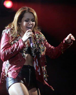 Miley Cyrus Performing On Stage And Exposing Her Fucking Huge Cleavage Porn Pictures XXX Photos