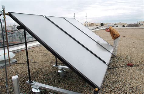 Greening Tinker Base Installing Solar Hot Water Heating Panels