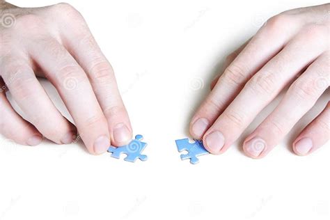 Man Assembling Two Blue Puzzle Pieces Stock Image Image Of Challenge