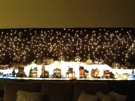 My Christmas Village Backdrop Is Icicle Lights Hung On The Wall With