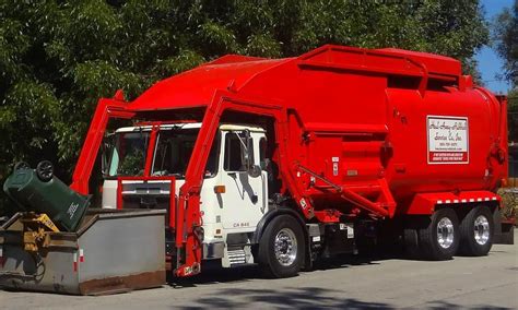 A Bright Red Autocar ACX Amrep HX 450 FL For Haul Away Rubbish Collects