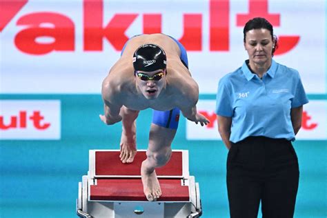 World record holder Pan Zhanle takes 100m freestyle gold in Doha ...