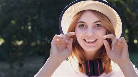 Portrait Of Pretty Positive Teenage Girl With Red Hair Wearing Straw